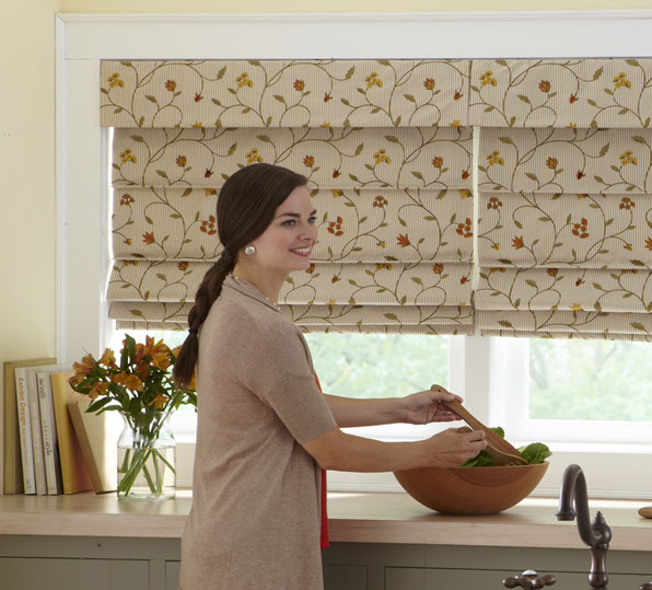 Fabric Roman Shades Covering a Kitchen Window